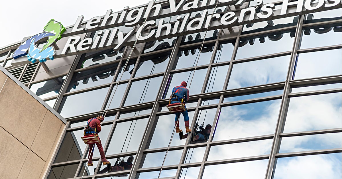 Superhero Window Washers Provide Children a PreThanksgiving Treat